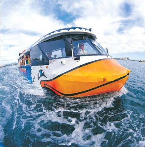 a bus in the water on the water at Hilton Surfers Paradise Luxury Suite - 2Bedroom, Free Car Park in Gold Coast