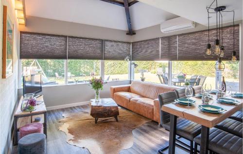 a living room with a couch and a table at Oud Kempen Bungalow 99 in Stavenisse