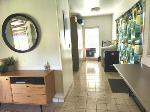 a bathroom with a sink and a mirror on the wall at Simply Coastal in Kurrimine Beach