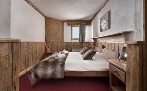 Llit o llits en una habitació de Ancolies Val Thorens