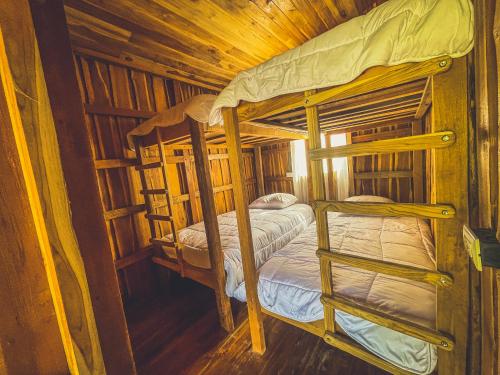Una cama o camas en una habitación de Casa rustica vacacional Cobano