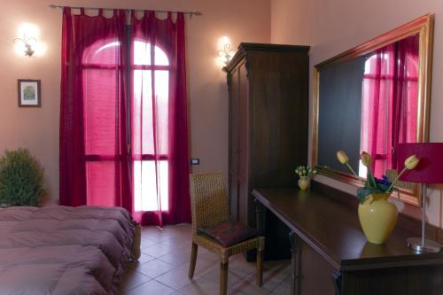 Ένα ή περισσότερα κρεβάτια σε δωμάτιο στο Agriturismo Rajata