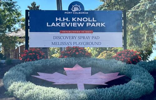 a sign for a park with a maple leaf at The Lakeview Loft in Port Colborne