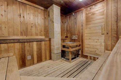 an empty wooden sauna with a bench in it at Plaza 1409 by Summit County Mountain Retreats in Keystone