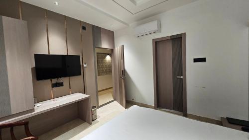 TV a/nebo společenská místnost v ubytování Hotel Grand City