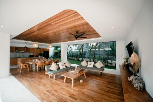 a living room with a couch and a table at Seminyak Villa Paya paya Luxury near beach-Potato Head in Seminyak