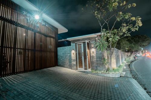 a building on the side of a street at night at Seminyak Villa Paya paya Luxury near beach-Potato Head in Seminyak