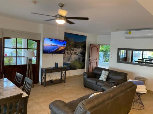 a living room with a couch and a table at Las Villas de Playa Blanca in Río Hato