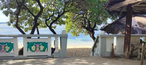 a building on the beach with a view of the ocean at JP Baybay View Beach Resort in Bolinao