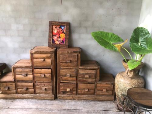 a pile of wooden crates with a picture on top at On The Mekong Resort in Luang Prabang
