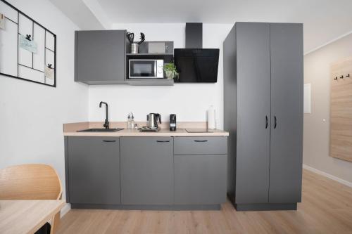 Η κουζίνα ή μικρή κουζίνα στο Central Bonn Apartments I private parking I home2share