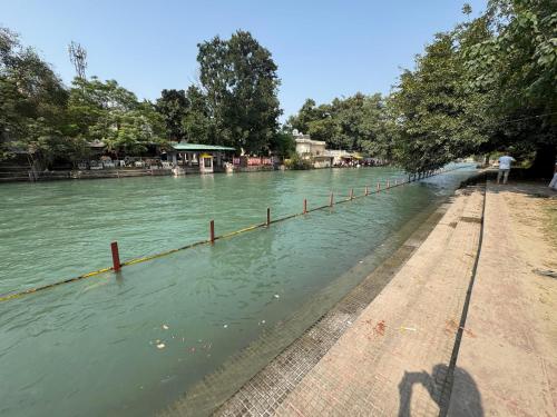 a flooded street with a body of water at Ganga Bliss in Haridwār