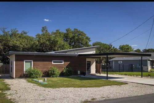 a small house with a pavilion in front of it at Large Hot Tub! Family Friendly - Stylish and Cozy in Canyon Lake