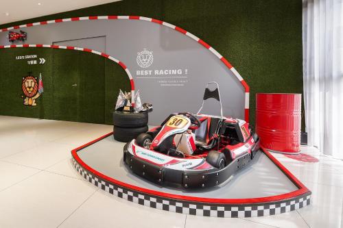 a race car on a display in a room at Holiday Garden Hotel SKM Park in Kaohsiung