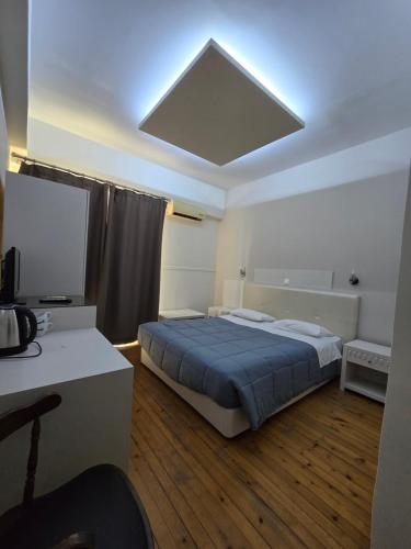 Ένα ή περισσότερα κρεβάτια σε δωμάτιο στο Aegean Sea Rooms