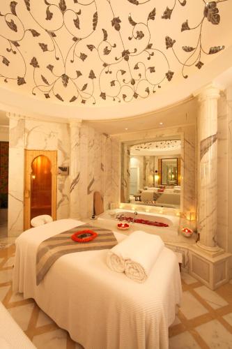 a large bedroom with two beds and a bathroom at The Imperial, New Delhi in New Delhi