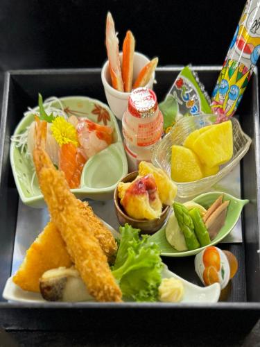 a tray of food with different types of food on it at Honjin in Izunokuni