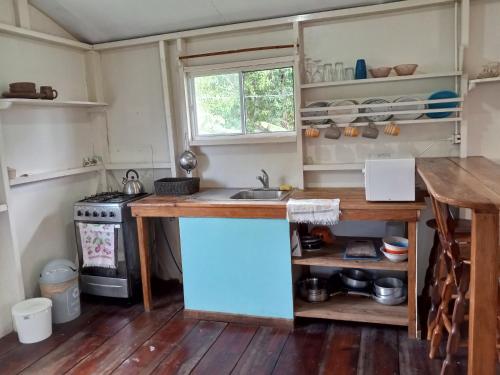 a kitchen with a sink and a counter top at Christina's Guest House OFFICIAL in Little Corn Island