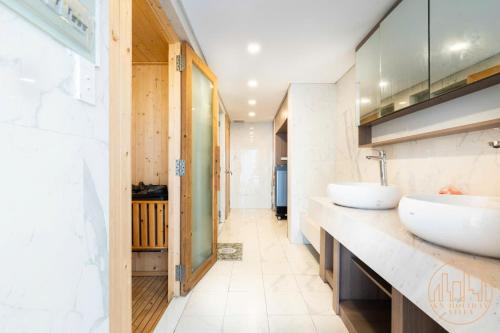 a bathroom with two sinks on a counter at KN 2 Villa - Venuestay in Ho Chi Minh City