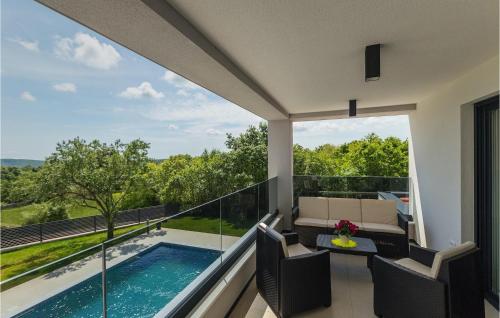 a balcony with a view of a swimming pool at Villa Lucas in Pula