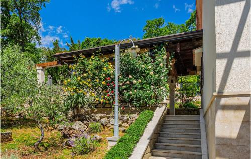 a house with a garden with an apple tree at Nice Home In Cres With Wifi in Cres