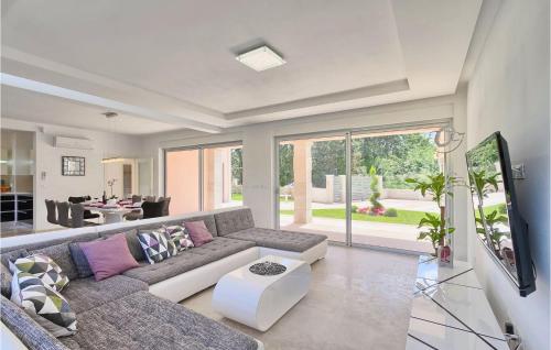 a living room with a couch and a tv at Villa Liv in Pula
