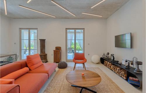 a living room with a couch and a table at Villa Calma in Šivati