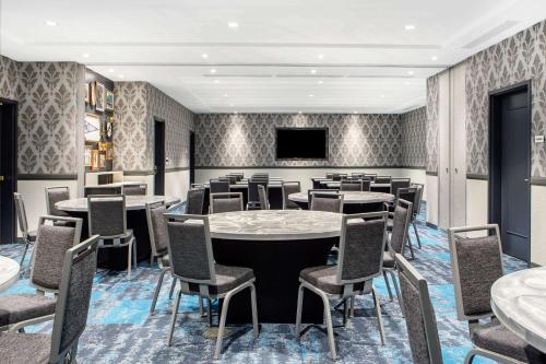 a conference room with a large table and chairs at Cambria Hotel New Orleans Downtown Warehouse District in New Orleans