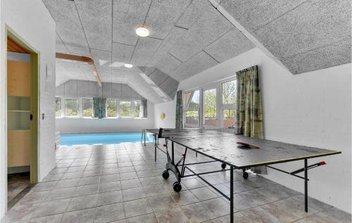 a ping pong table in the middle of a room at Pet Friendly Home In Ringkøbing in Ringkøbing