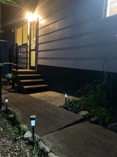 a house with two parking meters in front of it at Incredible mountain & sea views in Mapua