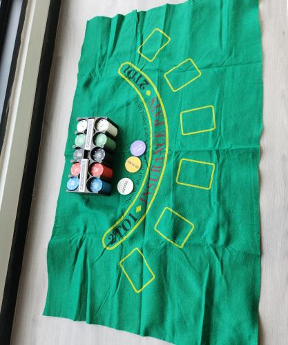 a table with a green table cloth with pills and a race track at Penang Georgetown 3BRCPGF The Martian #TvBox in Jelutong