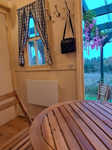 a room with a table and a window at Little Oakhurst in Clitheroe