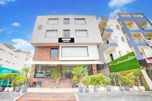 a building with a sign on the front of it at Palette Patel Nagar in Bhopal