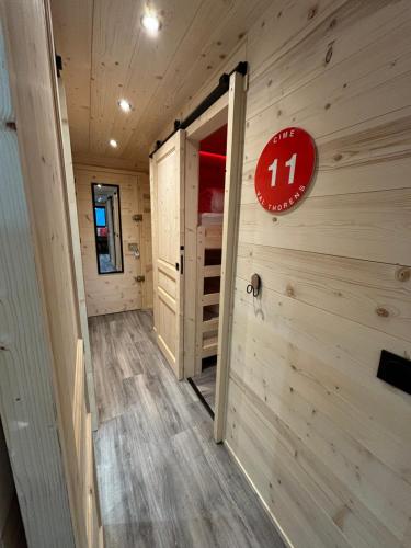 a room with a door and a sign on the wall at Les appartements de Makalu Val Thorens in Val Thorens