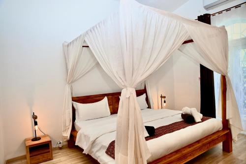Ένα ή περισσότερα κρεβάτια σε δωμάτιο στο Villa Anakao Mauritius