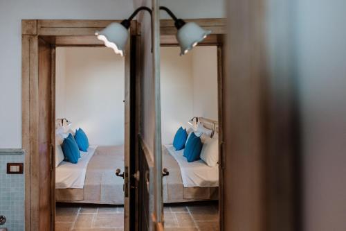 Postel nebo postele na pokoji v ubytování VinTage rooms