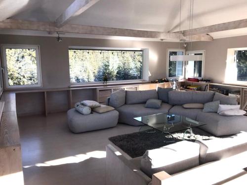 a living room with a couch and a table at Маєток Ліс і Гори in Bukovel