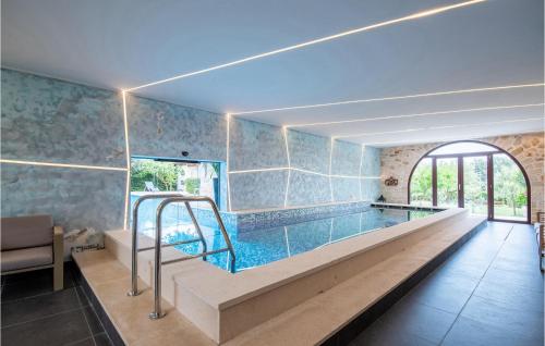 a large swimming pool in a room with at Villa Lv in Umag