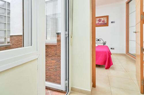 a door leading into a room with a table at Apartamento Lola 1 in Nerja