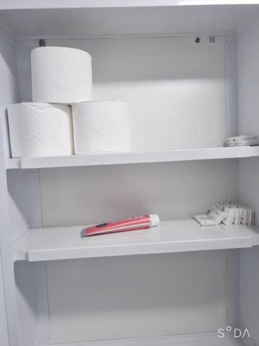 a shelf with toilet paper and a pen on it at #A6 Open sale - 5mins to Hongdae Station in Seoul