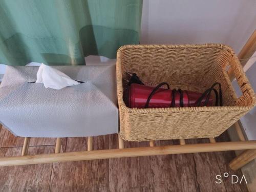 a basket sitting on the floor next to a table at #A6 Open sale - 5mins to Hongdae Station in Seoul