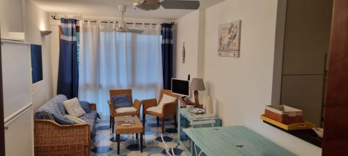 a living room with a couch and chairs and a table at Casa vacanza da Gabry sardinia in Porto Rotondo