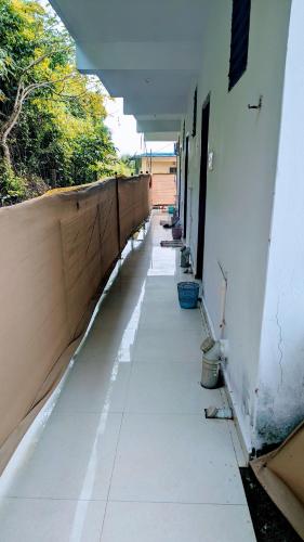 an empty hallway of a building with a wall at Shree Sai Beach Stay in Arambol