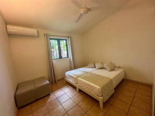 Ένα ή περισσότερα κρεβάτια σε δωμάτιο στο Villa Tamaris