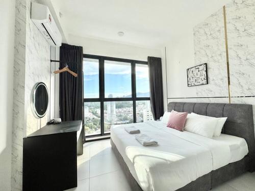 a bedroom with a large bed and a large window at Urban Suites #Luxury Leisure #Infinity Pool #local neighbourhood #4pax #2BR 2bath #2King #Quality well maintained #Private host in Jelutong