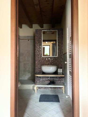 a bathroom with a sink and a mirror at Casa Cleopatra II in Bergamo
