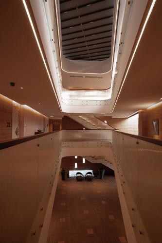 a hallway in a building with a ceiling at Vivienda Hotel and Villas, Diplomatic Quarter in Riyadh