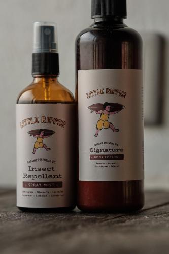 two bottles of sauce sitting next to each other at Little Ripper Boutique Lofts in Tanah Lot