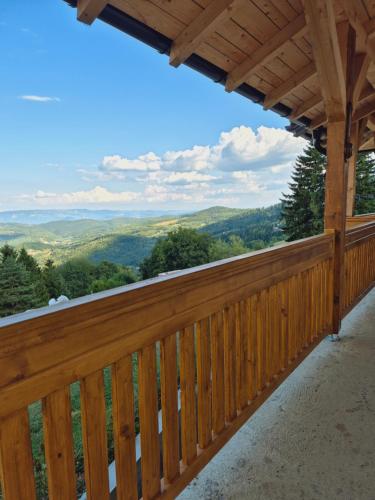 a deck with a view of the mountains at Zlatna Jabuka Lux in Prijepolje