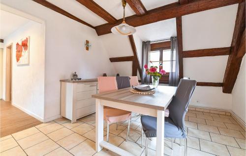 a dining room with a table and chairs at 2 Bedroom Lovely Apartment In Rouffach in Rouffach